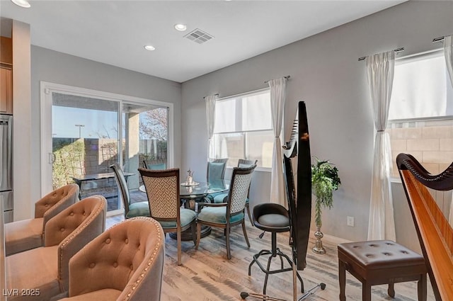 sitting room with light wood finished floors, visible vents, and recessed lighting