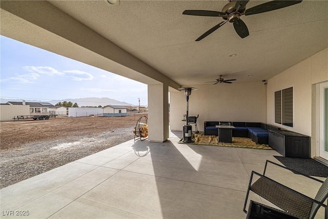 view of patio / terrace featuring an outdoor hangout area and ceiling fan