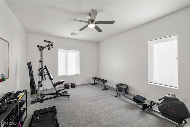 workout room featuring ceiling fan, visible vents, and baseboards