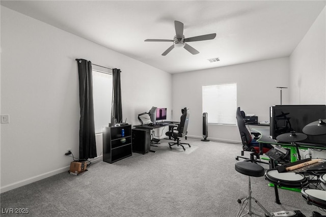 office featuring carpet floors, visible vents, ceiling fan, and baseboards