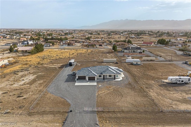 birds eye view of property with a mountain view