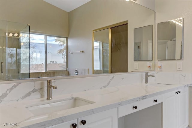 bathroom with double vanity and a sink