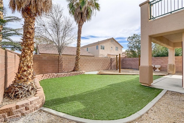 view of yard with a fenced backyard and a patio