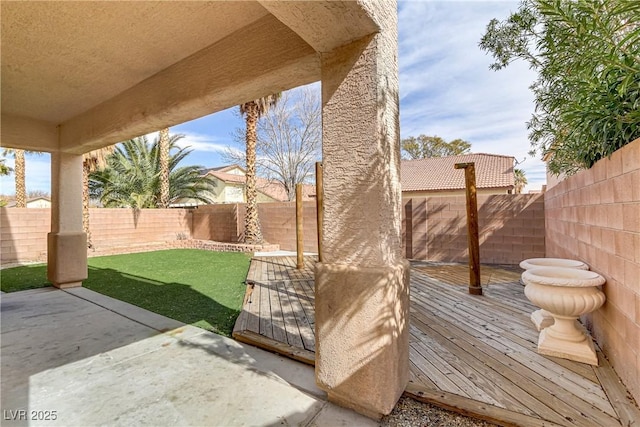 view of yard with a fenced backyard and a patio