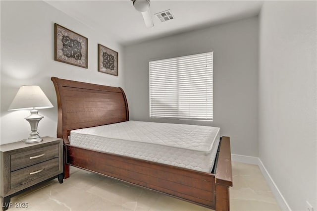 bedroom featuring a ceiling fan, visible vents, and baseboards