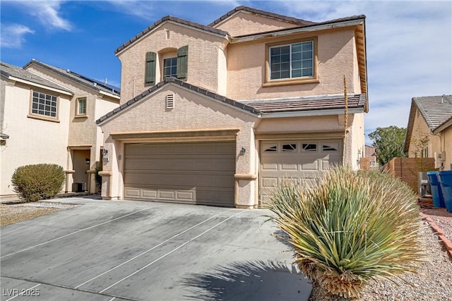 traditional-style home featuring driveway, cooling unit, a tiled roof, and stucco siding