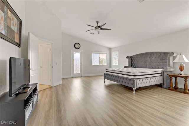 bedroom with lofted ceiling, visible vents, light wood-style floors, a ceiling fan, and baseboards