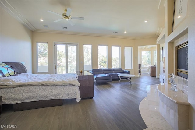 bedroom with ornamental molding, wood finished floors, and visible vents