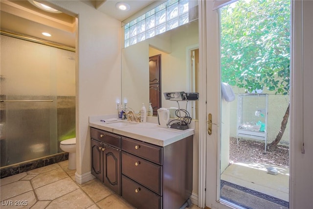 bathroom featuring tile patterned flooring, vanity, toilet, and recessed lighting