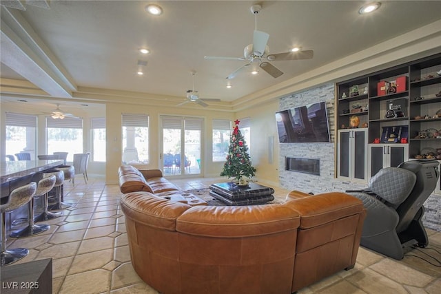 living area featuring a healthy amount of sunlight, a fireplace, and recessed lighting