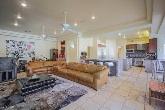 living room featuring recessed lighting, visible vents, ceiling fan, and light tile patterned floors