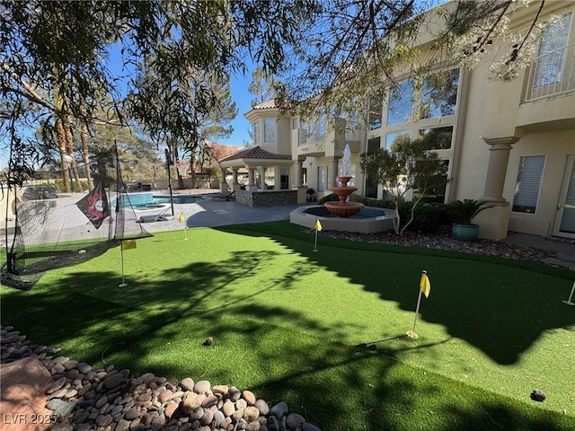 view of yard featuring a fenced in pool, fence, a gazebo, and a patio