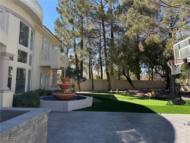 view of yard featuring a patio and fence