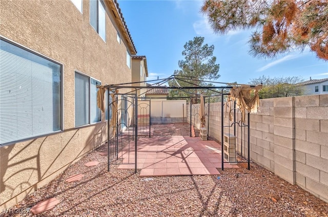 view of patio / terrace with a fenced backyard and a gazebo