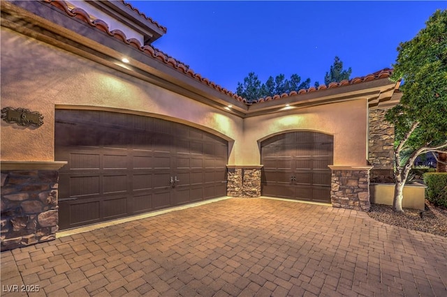 exterior space featuring decorative driveway