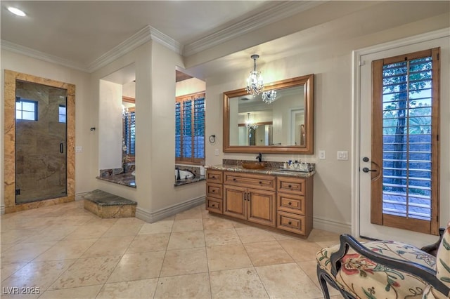 bathroom featuring tile patterned flooring, vanity, baseboards, a shower stall, and crown molding