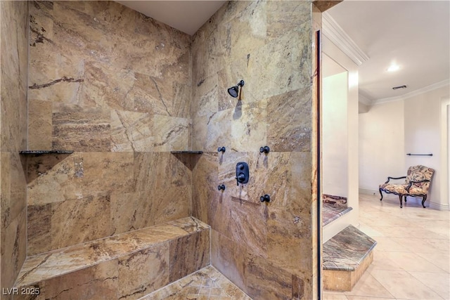 bathroom with ornamental molding, tiled shower, and visible vents