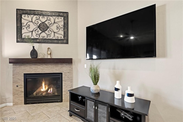 room details featuring a glass covered fireplace