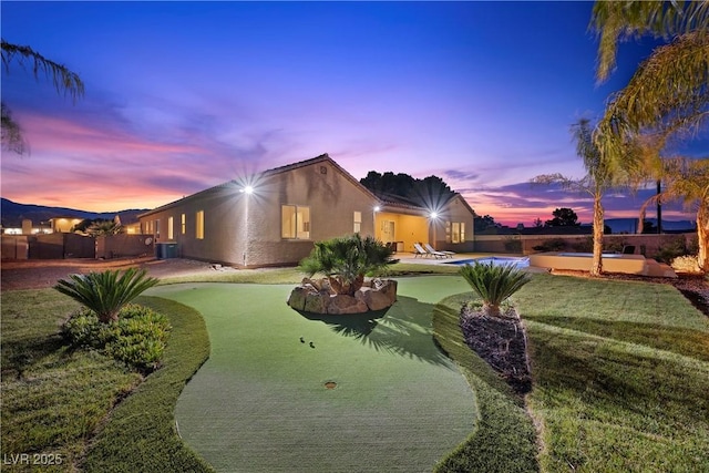 exterior space with a patio area, concrete driveway, and stucco siding