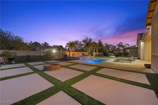 pool at dusk featuring a fenced backyard, a fenced in pool, and a patio