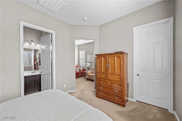 bedroom with light colored carpet, visible vents, and baseboards