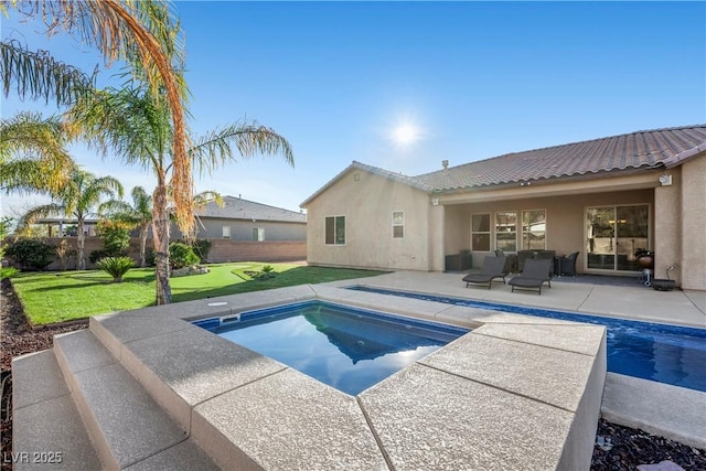 view of pool with a patio area, a fenced in pool, fence, and a lawn