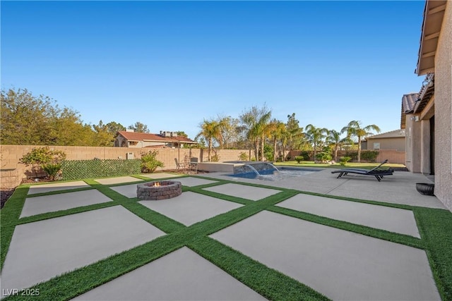 view of patio / terrace featuring an outdoor fire pit, a fenced in pool, and a fenced backyard