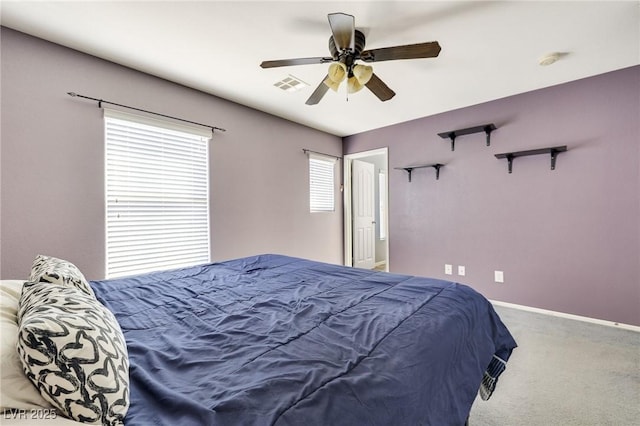 bedroom featuring baseboards, visible vents, ceiling fan, and carpet flooring