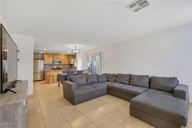 living room featuring recessed lighting, visible vents, and light tile patterned floors