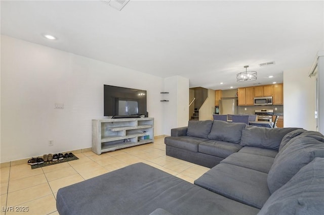 living room with light tile patterned floors, stairway, visible vents, and recessed lighting