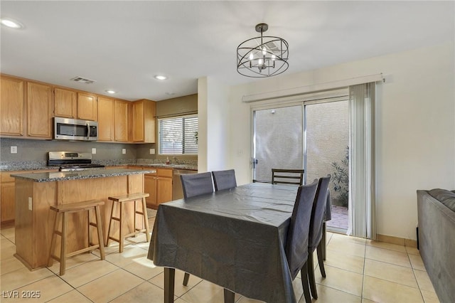 dining room with light tile patterned floors, recessed lighting, visible vents, baseboards, and an inviting chandelier