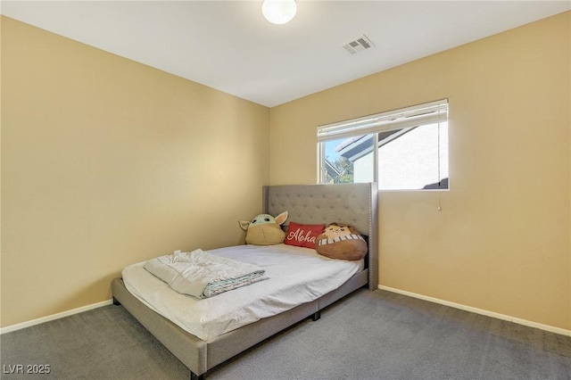 carpeted bedroom with baseboards and visible vents