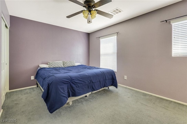 bedroom featuring light colored carpet, visible vents, and baseboards