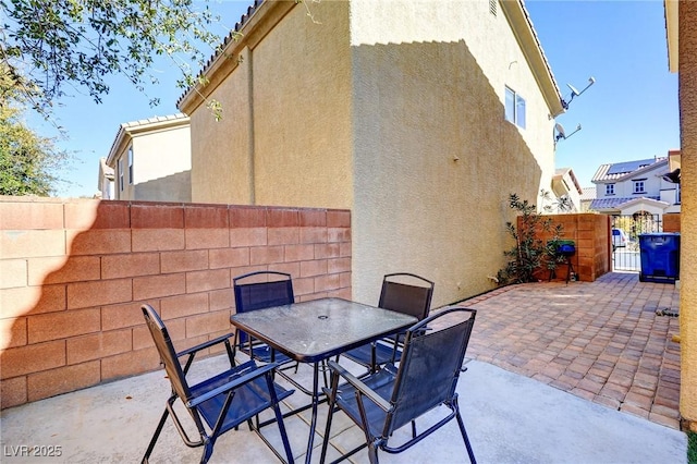 view of patio / terrace featuring outdoor dining space and fence