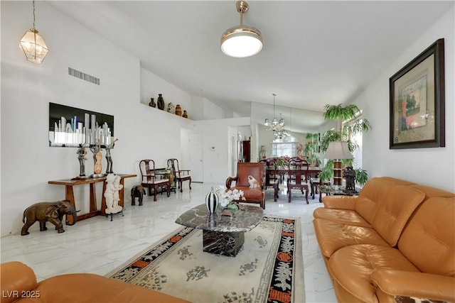 living room with marble finish floor, visible vents, a chandelier, and high vaulted ceiling