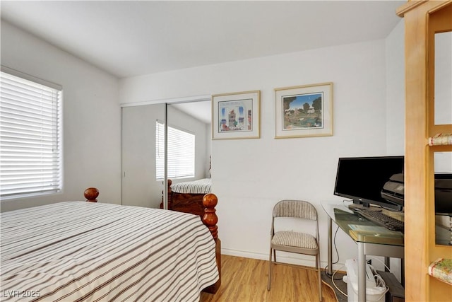 bedroom with light wood-style floors