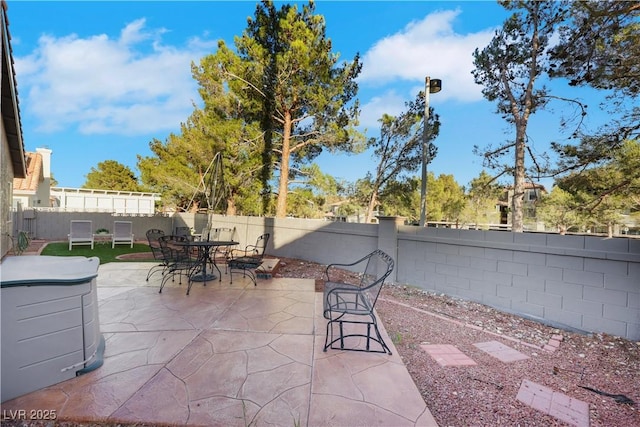 view of patio / terrace with outdoor dining area and a fenced backyard