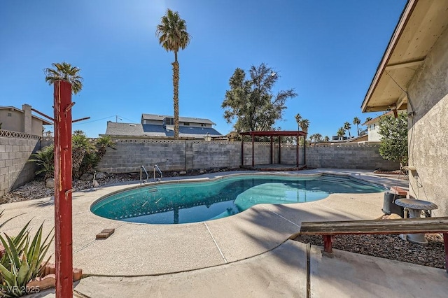 view of swimming pool featuring a patio area, a fenced backyard, and a fenced in pool