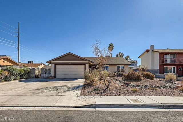 view of front of property with a garage, concrete driveway, and stucco siding