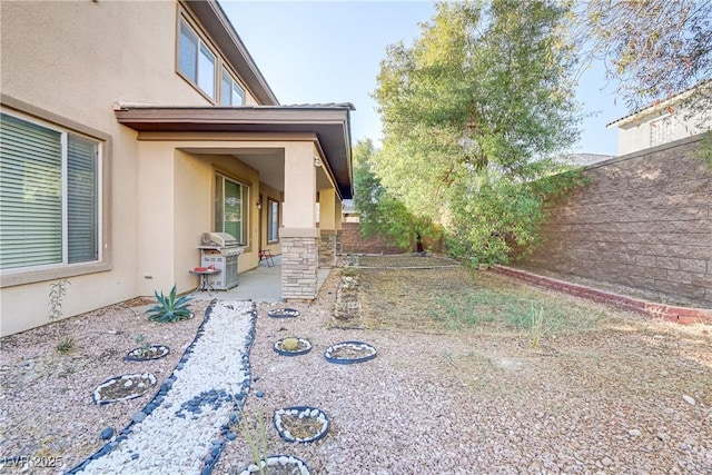 view of yard featuring a patio and fence