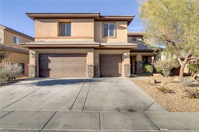 prairie-style home featuring stone siding, concrete driveway, an attached garage, and stucco siding