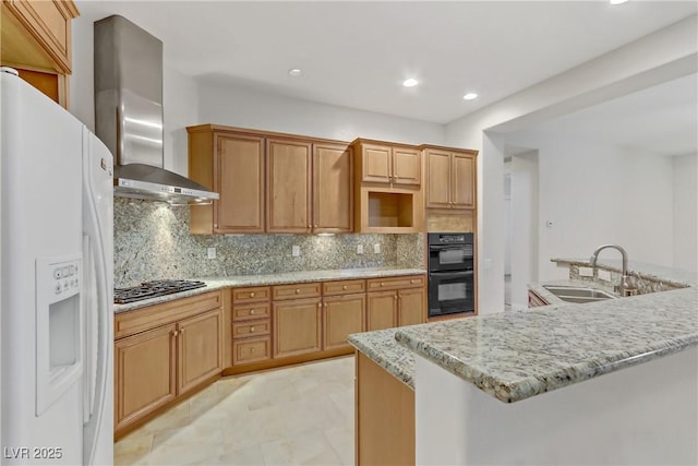 kitchen with dobule oven black, stainless steel gas stovetop, a sink, white fridge with ice dispenser, and wall chimney exhaust hood