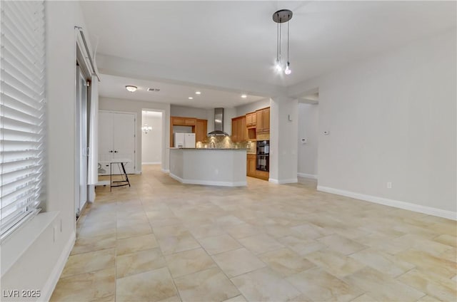 unfurnished living room with recessed lighting, visible vents, and baseboards