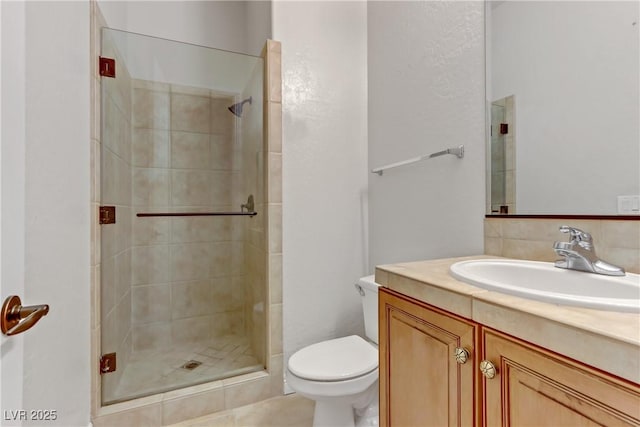 full bath with toilet, a stall shower, and vanity