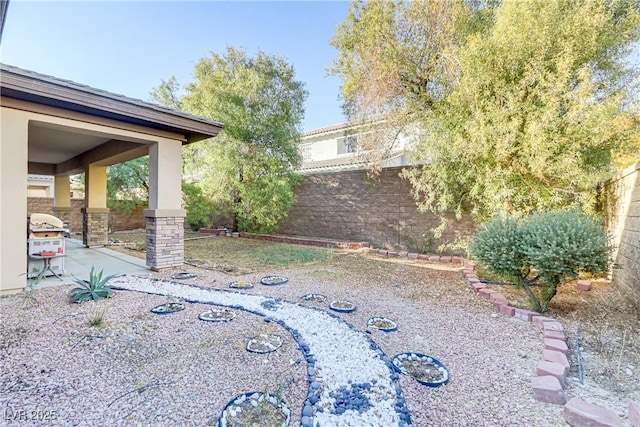 view of yard with a patio area and fence