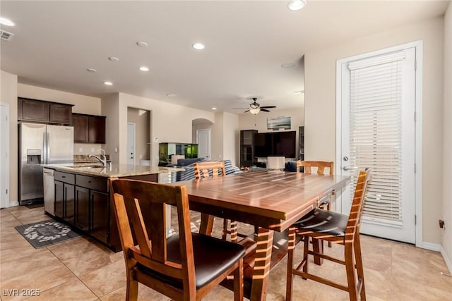 dining room with arched walkways, ceiling fan, light tile patterned floors, recessed lighting, and visible vents