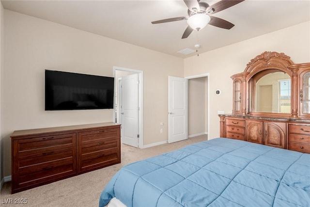 bedroom featuring light carpet, ceiling fan, and baseboards