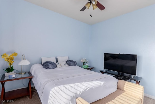 bedroom with carpet flooring, a ceiling fan, and baseboards