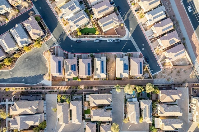 birds eye view of property with a residential view