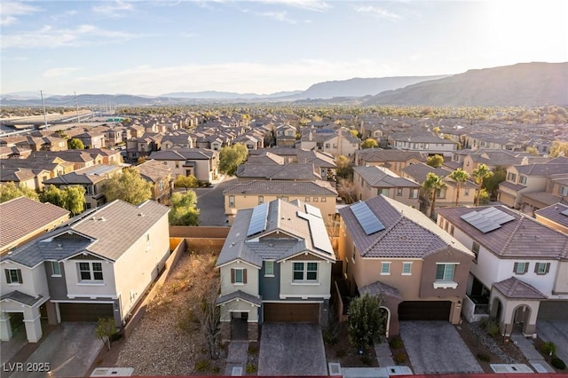 birds eye view of property with a mountain view and a residential view